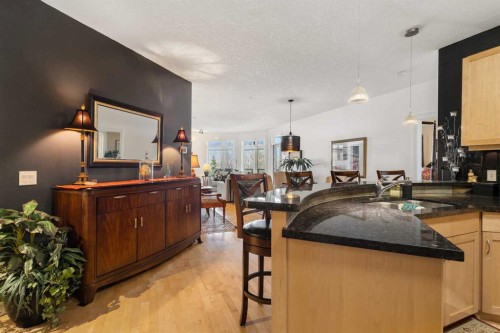 304-8 Hemlock Crescent Sw, Calgary, AB - Indoor Photo Showing Kitchen With Double Sink
