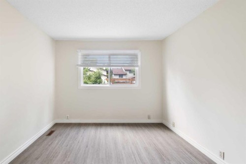 13 Bernard Drive Nw, Calgary, AB - Indoor Photo Showing Other Room