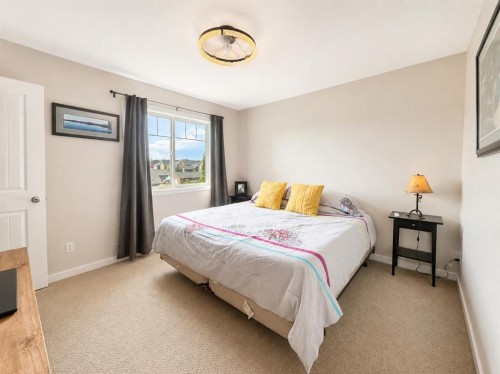 12 Fireside Bend, Cochrane, AB - Indoor Photo Showing Bedroom
