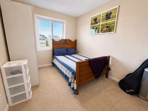 12 Fireside Bend, Cochrane, AB - Indoor Photo Showing Bedroom