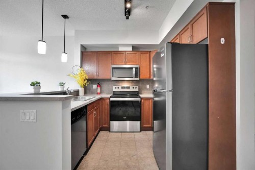 5-148 Rockyledge View Nw, Calgary, AB - Indoor Photo Showing Kitchen With Stainless Steel Kitchen