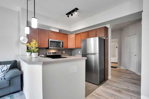 5-148 Rockyledge View Nw, Calgary, AB - Indoor Photo Showing Kitchen With Stainless Steel Kitchen