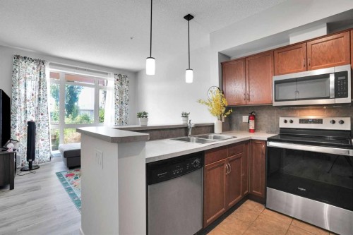 5-148 Rockyledge View Nw, Calgary, AB - Indoor Photo Showing Kitchen With Double Sink