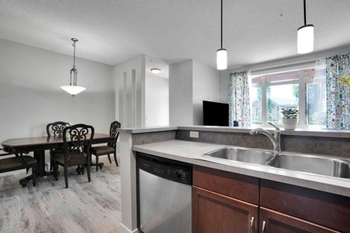 5-148 Rockyledge View Nw, Calgary, AB - Indoor Photo Showing Kitchen With Double Sink
