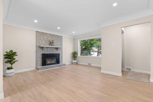 2007 Cottonwood Crescent Se, Calgary, AB - Indoor Photo Showing Living Room With Fireplace