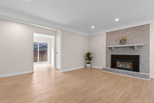 2007 Cottonwood Crescent Se, Calgary, AB - Indoor Photo Showing Living Room With Fireplace
