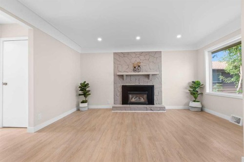 2007 Cottonwood Crescent Se, Calgary, AB - Indoor Photo Showing Living Room With Fireplace