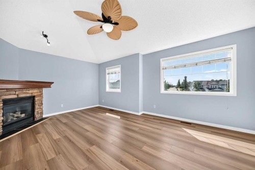 214 Royal Birch Heath Nw, Calgary, AB - Indoor Photo Showing Living Room With Fireplace