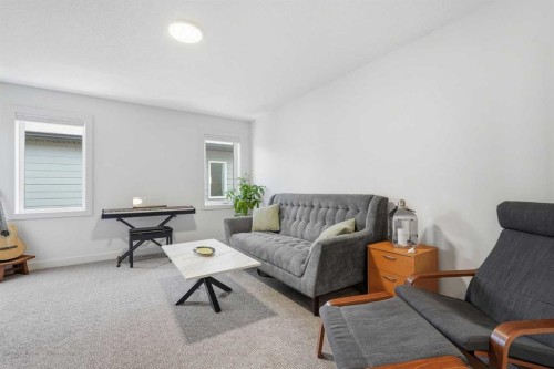 129 Wolf Hollow Villas Se, Calgary, AB - Indoor Photo Showing Living Room