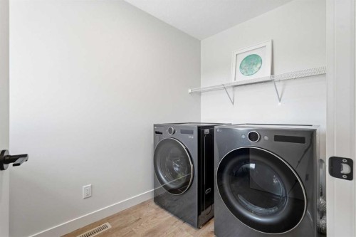 129 Wolf Hollow Villas Se, Calgary, AB - Indoor Photo Showing Laundry Room