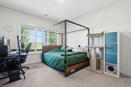129 Wolf Hollow Villas Se, Calgary, AB - Indoor Photo Showing Bedroom