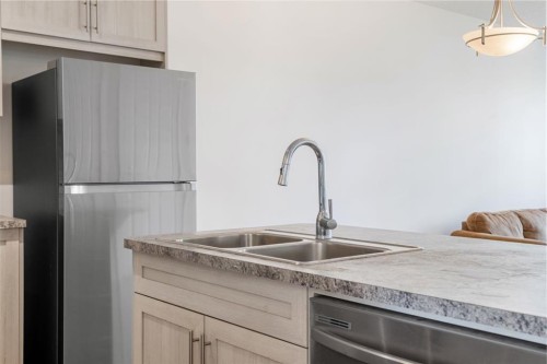 61 Cityline Gate Ne, Calgary, AB - Indoor Photo Showing Kitchen With Double Sink