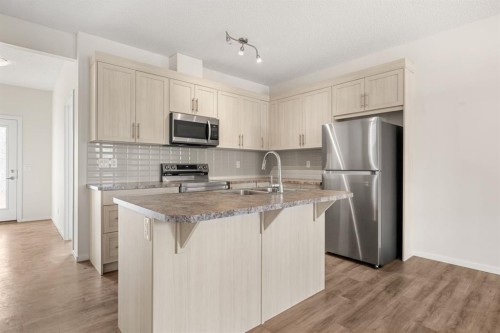 61 Cityline Gate Ne, Calgary, AB - Indoor Photo Showing Kitchen With Double Sink