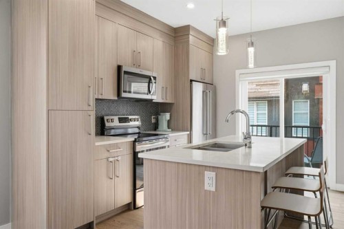 1932 26A Street Sw, Calgary, AB - Indoor Photo Showing Kitchen With Double Sink With Upgraded Kitchen