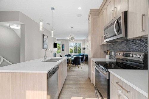 1932 26A Street Sw, Calgary, AB - Indoor Photo Showing Kitchen With Double Sink With Upgraded Kitchen