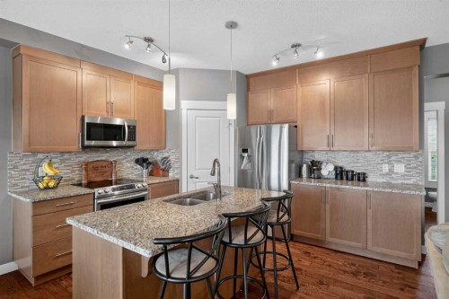 268 Rainbow Falls Green, Chestermere, AB - Indoor Photo Showing Kitchen With Stainless Steel Kitchen With Double Sink With Upgraded Kitchen