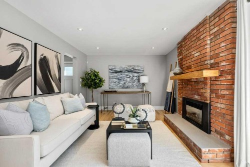 10411 Maplemont Road Se, Calgary, AB - Indoor Photo Showing Living Room With Fireplace