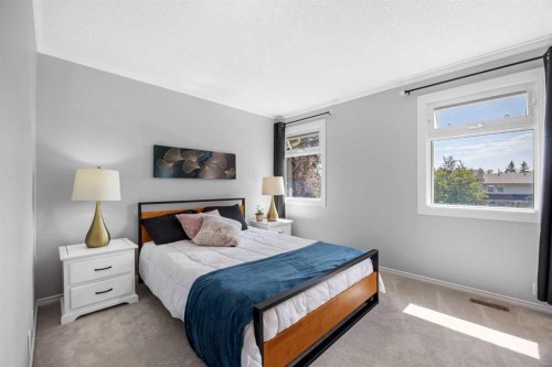 75 Woodhill Court Sw, Calgary, AB - Indoor Photo Showing Bedroom