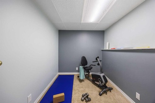 75 Woodhill Court Sw, Calgary, AB - Indoor Photo Showing Gym Room
