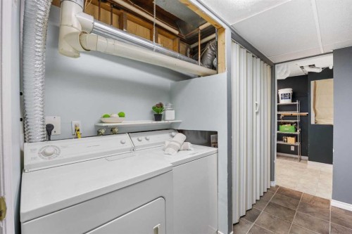 75 Woodhill Court Sw, Calgary, AB - Indoor Photo Showing Laundry Room