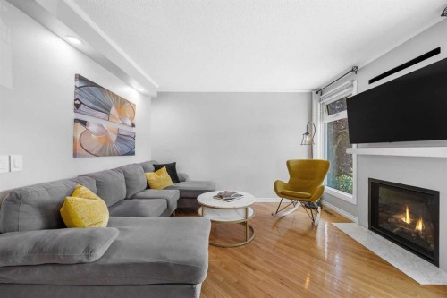 75 Woodhill Court Sw, Calgary, AB - Indoor Photo Showing Living Room With Fireplace