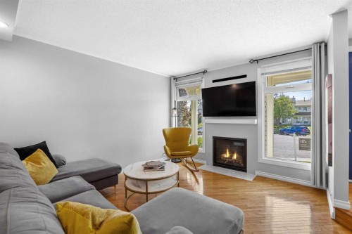 75 Woodhill Court Sw, Calgary, AB - Indoor Photo Showing Living Room With Fireplace