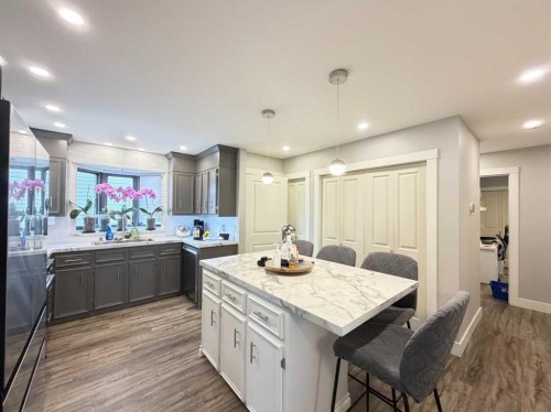 151 Sandstone Place Nw, Calgary, AB - Indoor Photo Showing Kitchen With Double Sink