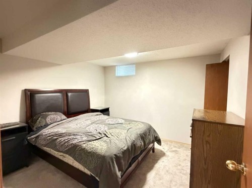 151 Sandstone Place Nw, Calgary, AB - Indoor Photo Showing Bedroom