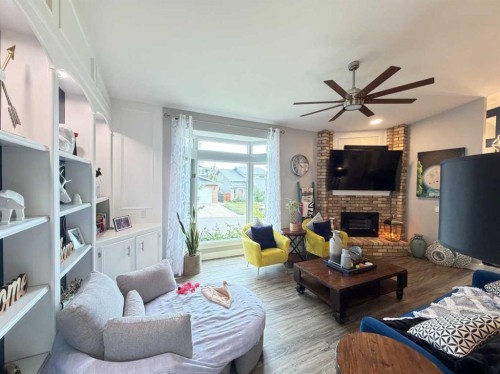151 Sandstone Place Nw, Calgary, AB - Indoor Photo Showing Living Room With Fireplace