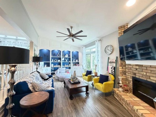151 Sandstone Place Nw, Calgary, AB - Indoor Photo Showing Living Room With Fireplace