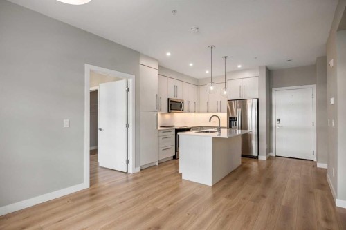 203-383 Smith Street Nw, Calgary, AB - Indoor Photo Showing Kitchen With Stainless Steel Kitchen With Upgraded Kitchen