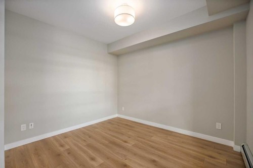 203-383 Smith Street Nw, Calgary, AB - Indoor Photo Showing Other Room