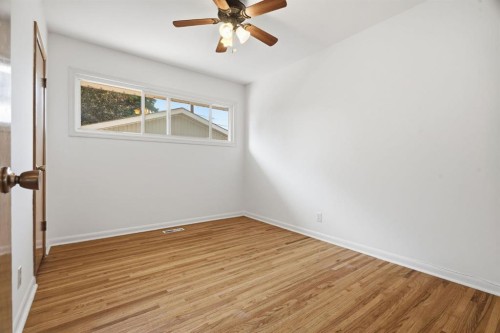 100 Westminster Drive Sw, Calgary, AB - Indoor Photo Showing Other Room