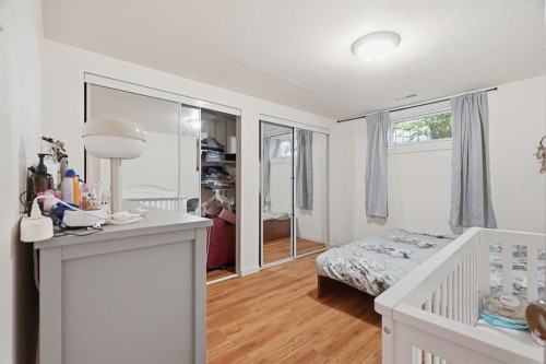 100 Westminster Drive Sw, Calgary, AB - Indoor Photo Showing Bedroom