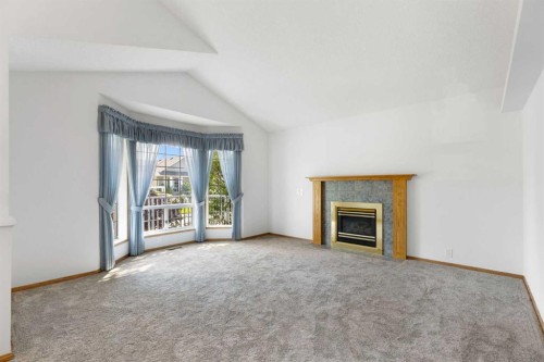 90 Martinridge Crescent Ne, Calgary, AB - Indoor Photo Showing Living Room With Fireplace