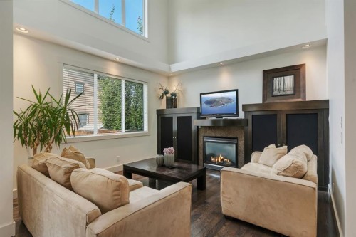 242 Valley Woods Place Nw, Calgary, AB - Indoor Photo Showing Living Room With Fireplace