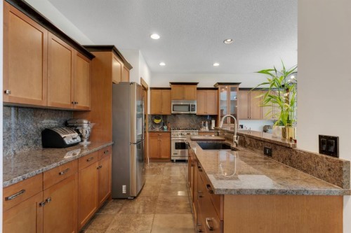 242 Valley Woods Place Nw, Calgary, AB - Indoor Photo Showing Kitchen