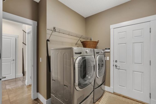 242 Valley Woods Place Nw, Calgary, AB - Indoor Photo Showing Laundry Room