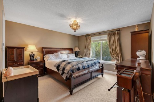242 Valley Woods Place Nw, Calgary, AB - Indoor Photo Showing Bedroom