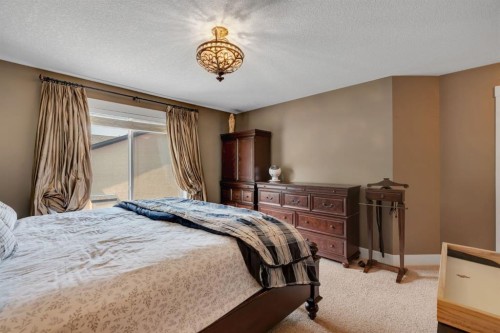 242 Valley Woods Place Nw, Calgary, AB - Indoor Photo Showing Bedroom