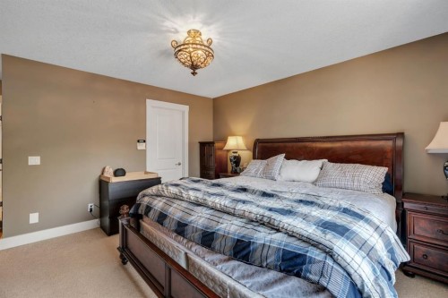 242 Valley Woods Place Nw, Calgary, AB - Indoor Photo Showing Bedroom