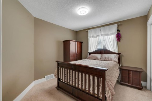 242 Valley Woods Place Nw, Calgary, AB - Indoor Photo Showing Bedroom