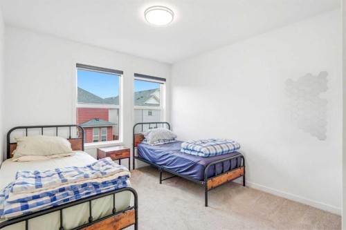 49 Copperhead Road Se, Calgary, AB - Indoor Photo Showing Bedroom