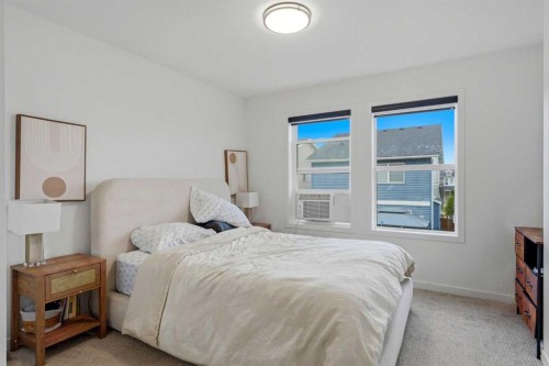 49 Copperhead Road Se, Calgary, AB - Indoor Photo Showing Bedroom