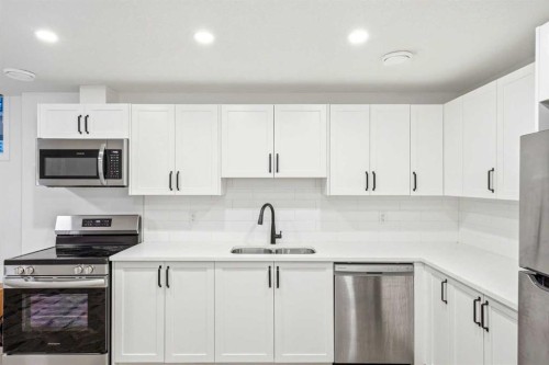 49 Copperhead Road Se, Calgary, AB - Indoor Photo Showing Kitchen With Double Sink With Upgraded Kitchen