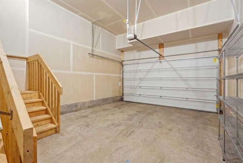 49 Copperhead Road Se, Calgary, AB - Indoor Photo Showing Garage