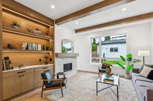 4920 21 Avenue Nw, Calgary, AB - Indoor Photo Showing Living Room With Fireplace