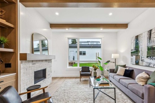 4920 21 Avenue Nw, Calgary, AB - Indoor Photo Showing Living Room With Fireplace