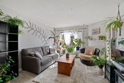 2209-950 Arbour Lake Road Nw, Calgary, AB - Indoor Photo Showing Living Room