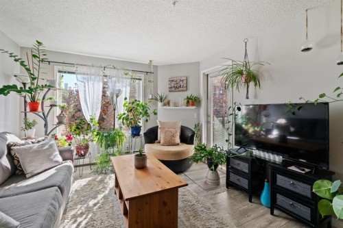 2209-950 Arbour Lake Road Nw, Calgary, AB - Indoor Photo Showing Living Room